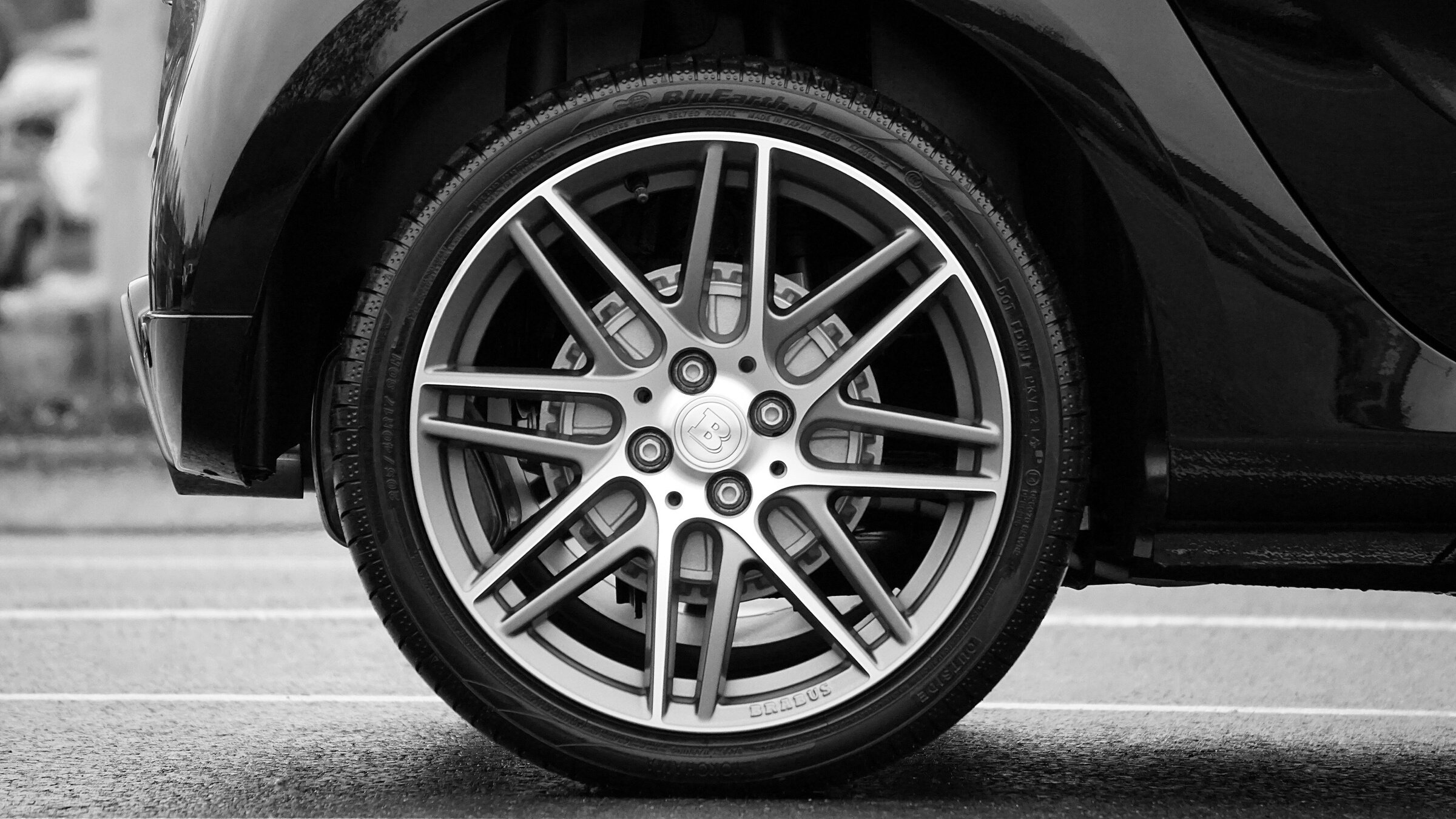 Close-up Photograph of Chrome Vehicle Wheel